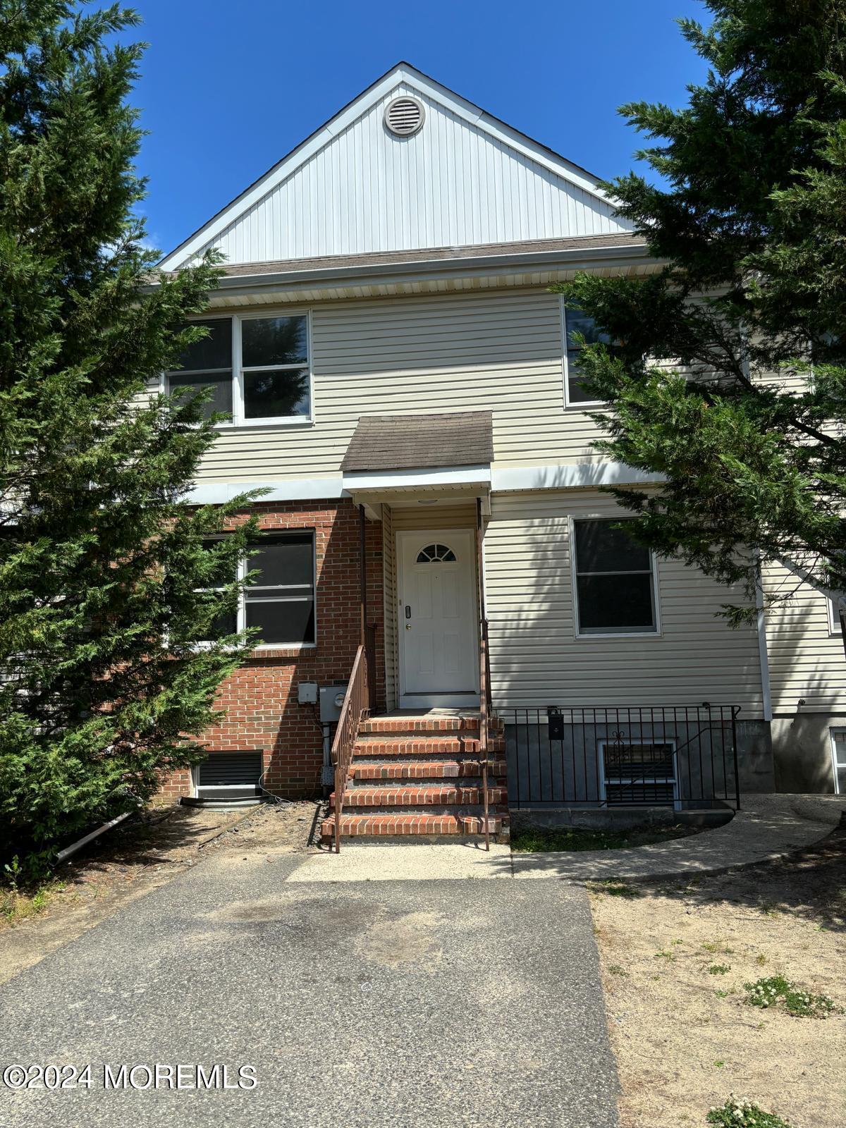 a front view of a house with garage