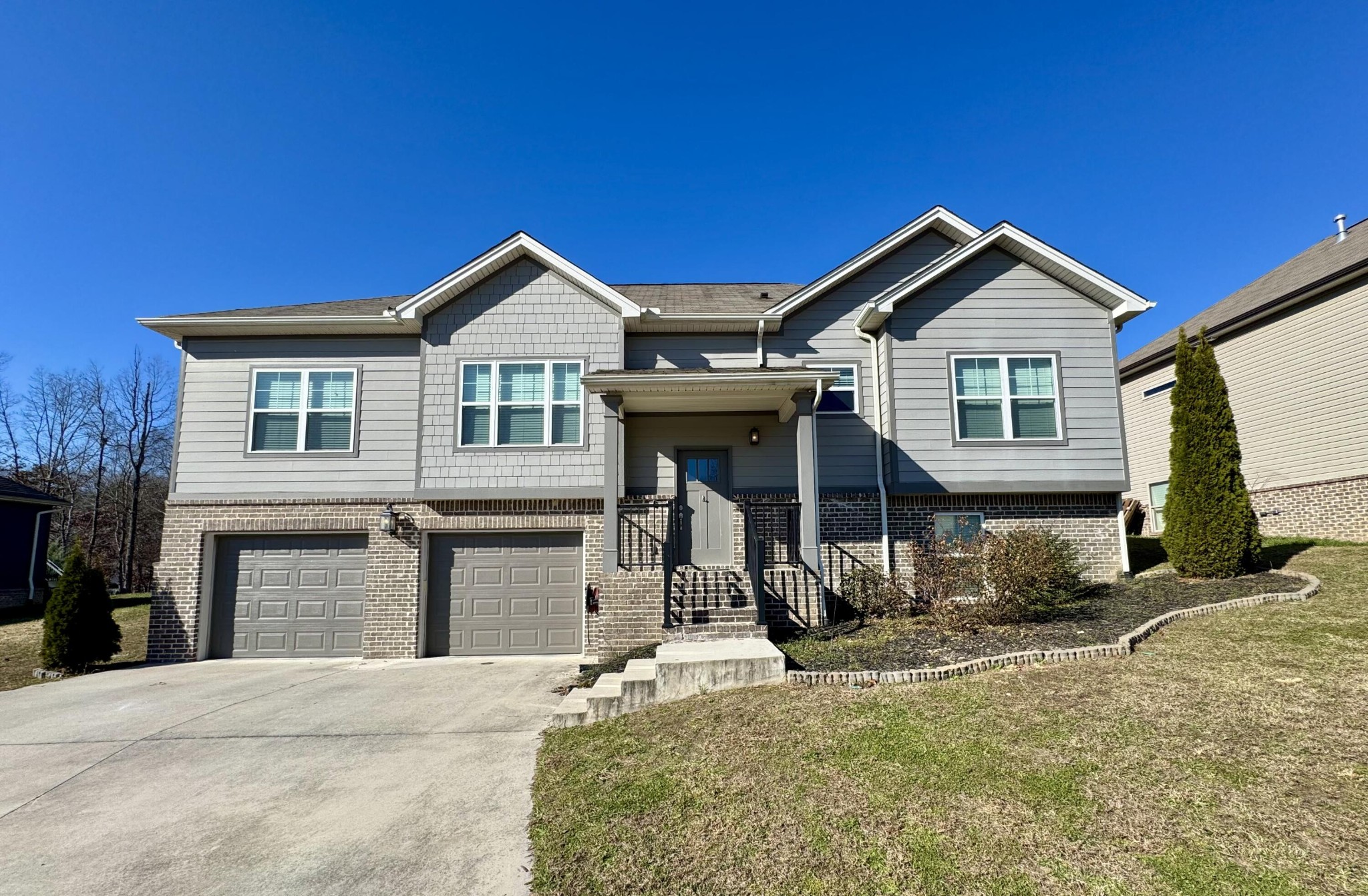 a front view of a house with a yard