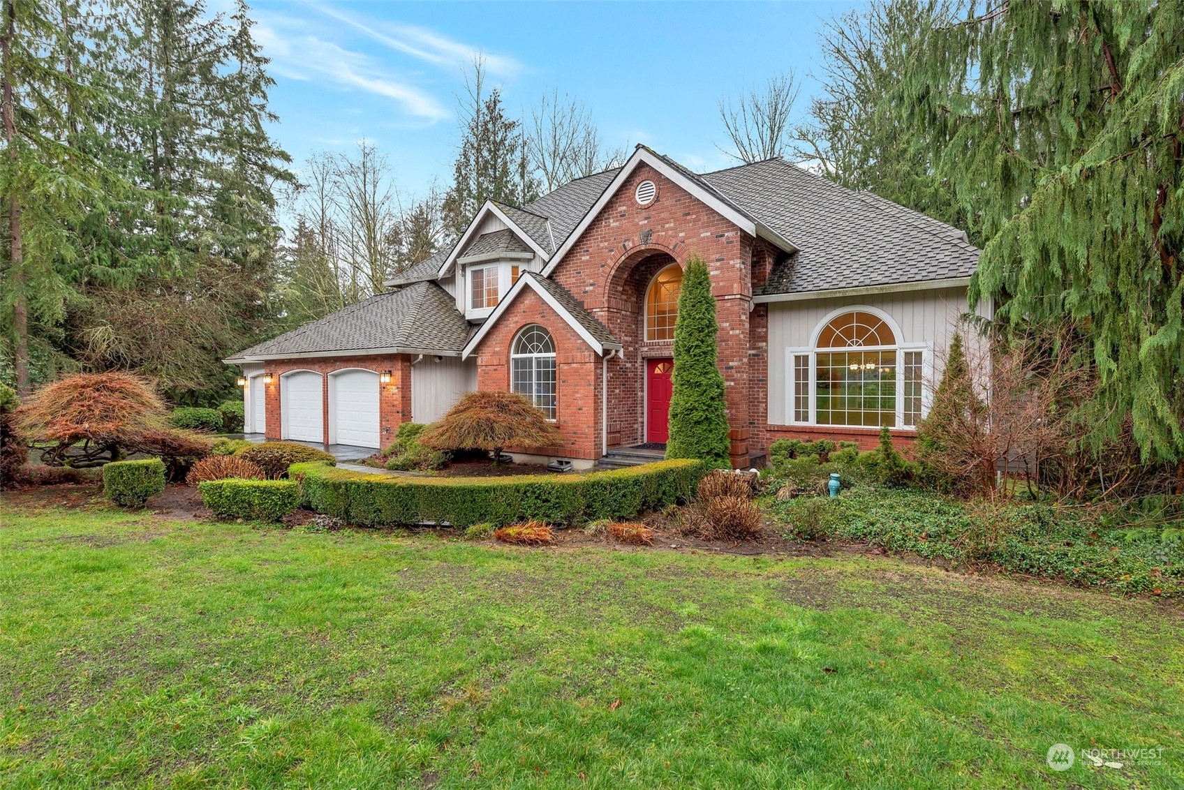 a front view of a house with garden