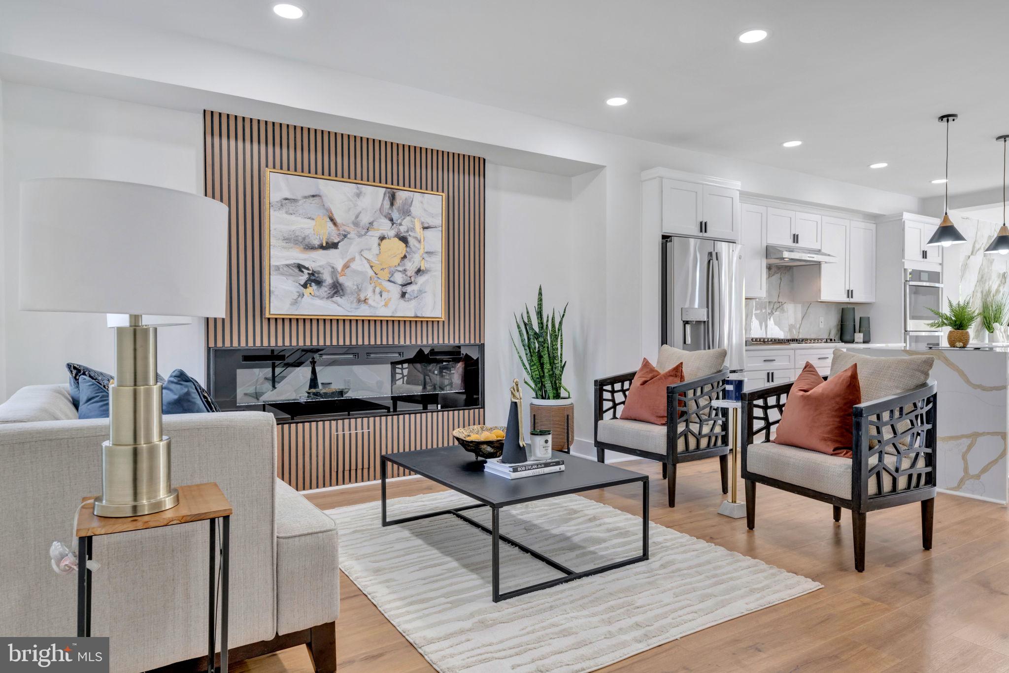 a living room with furniture and a painting on the wall