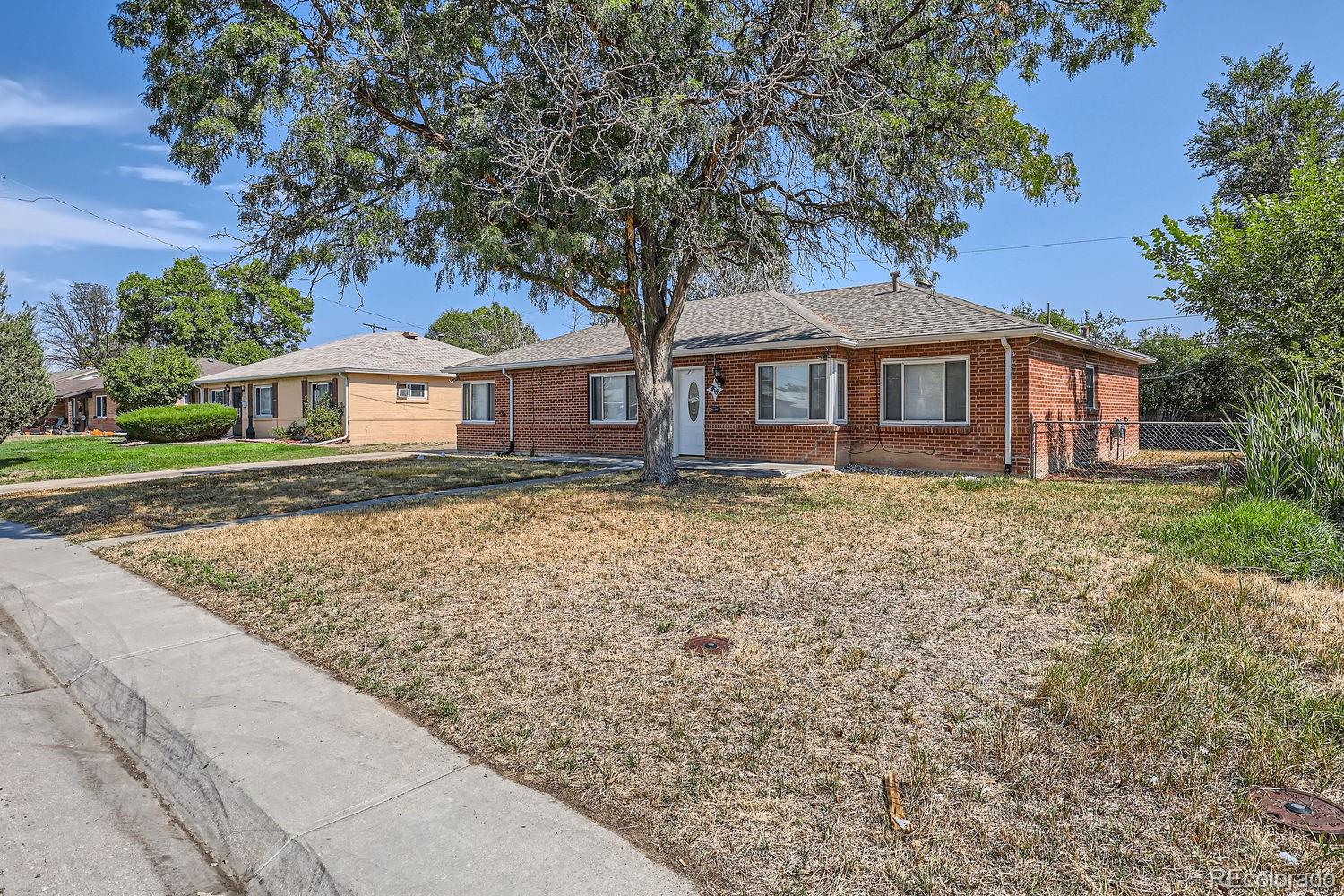 front view of a house with a yard