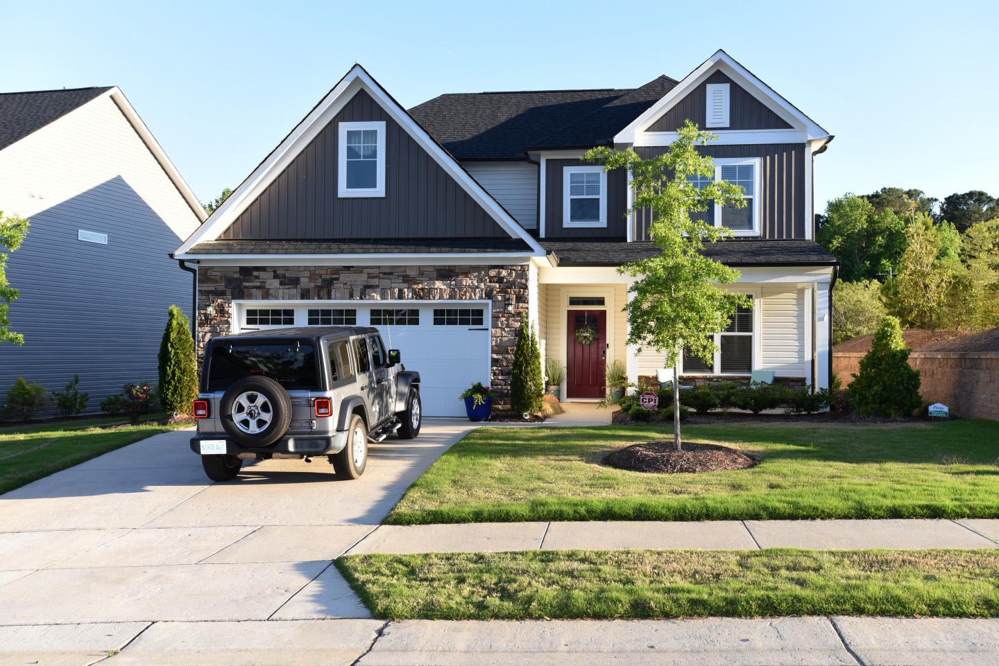 a front view of a house with a yard