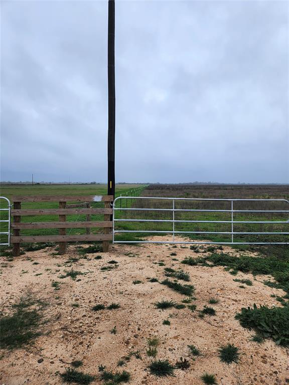 a view of a field with an ocean view