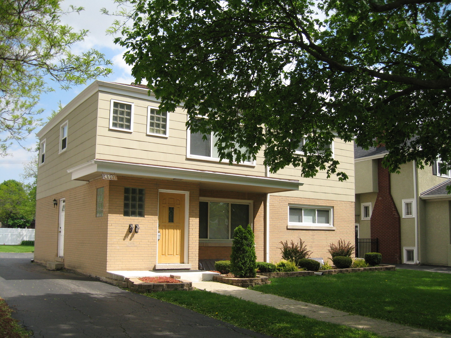 front view of a house with a yard