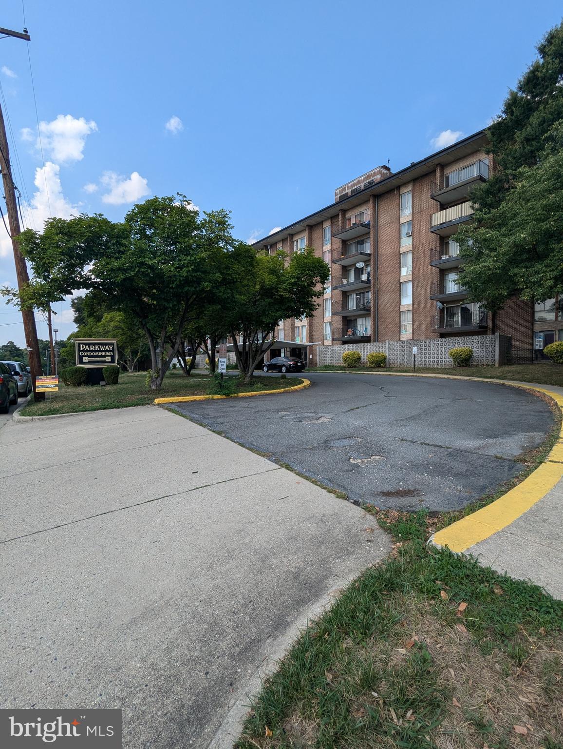 a view of a parked cars in front of a building