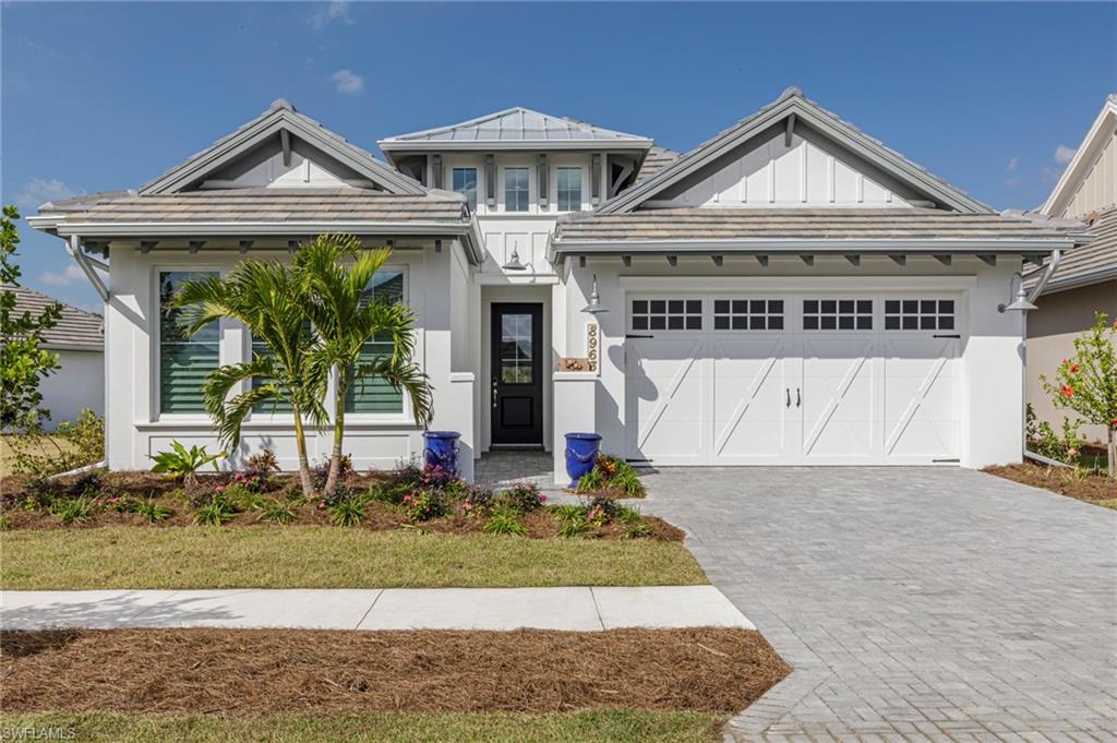 View of front facade featuring a garage