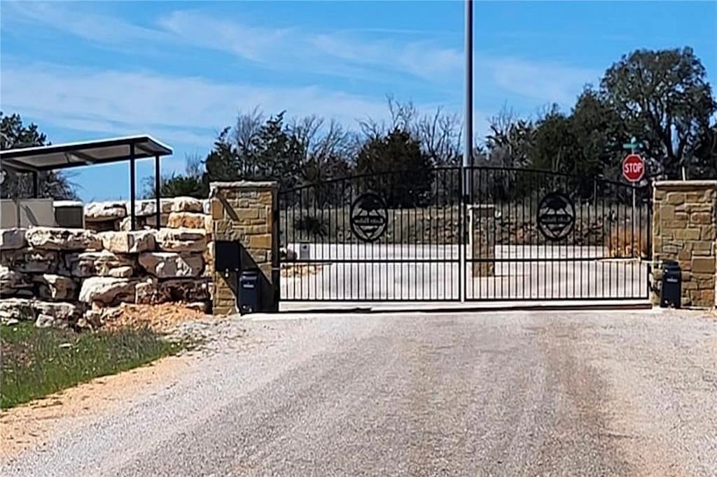 a view of a gate and fence