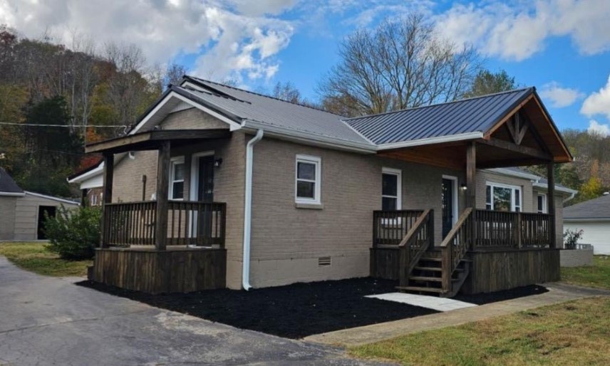 a front view of a house with yard