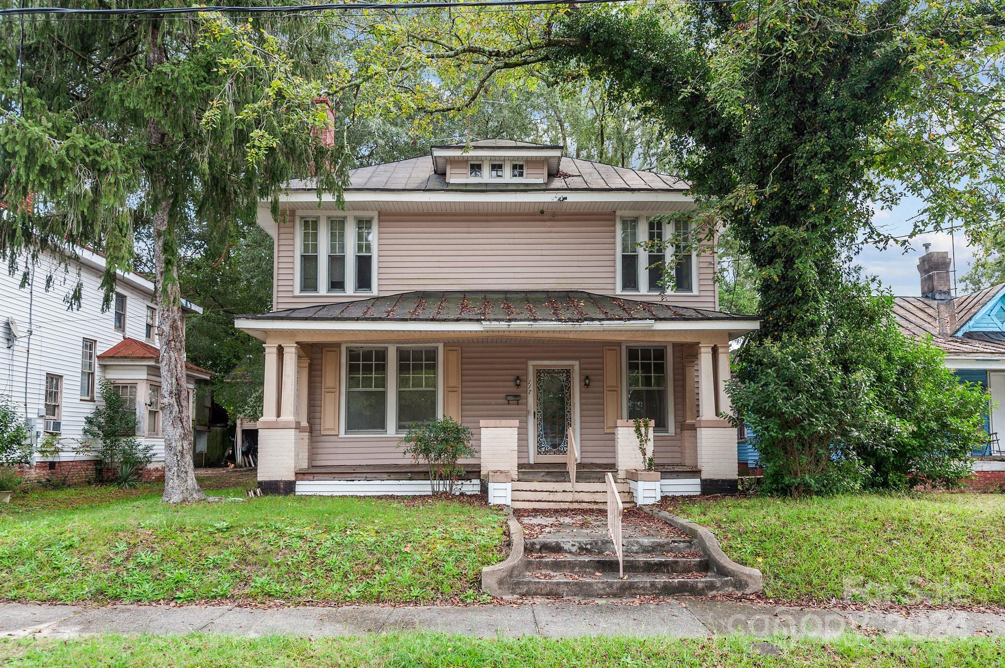 front view of a house with a yard