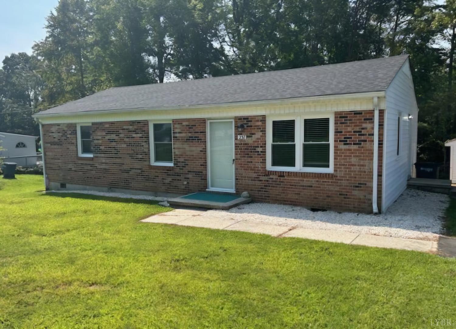 front view of a house with a yard