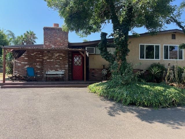 front view of house with potted plants