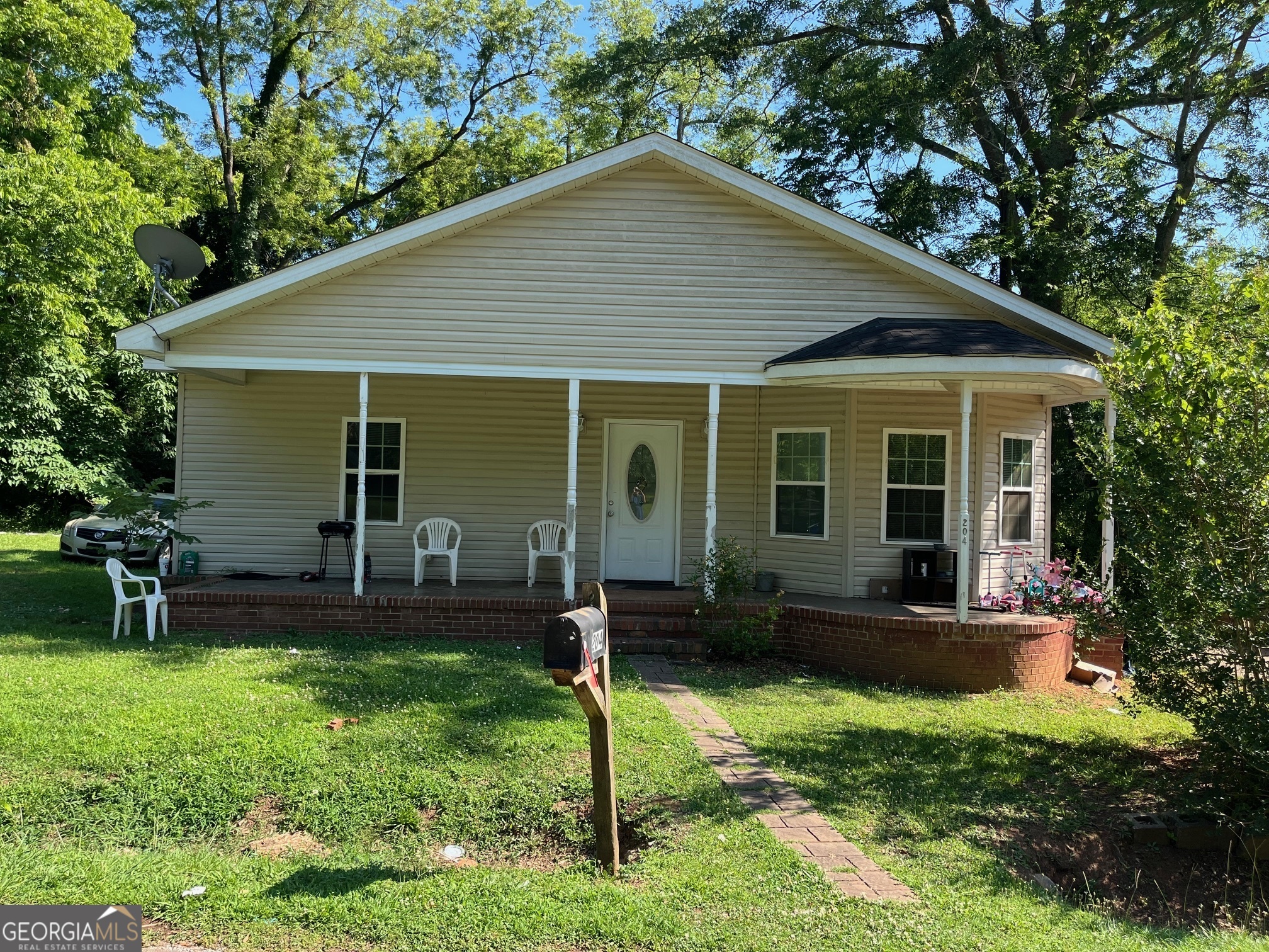 front view of a house with a yard