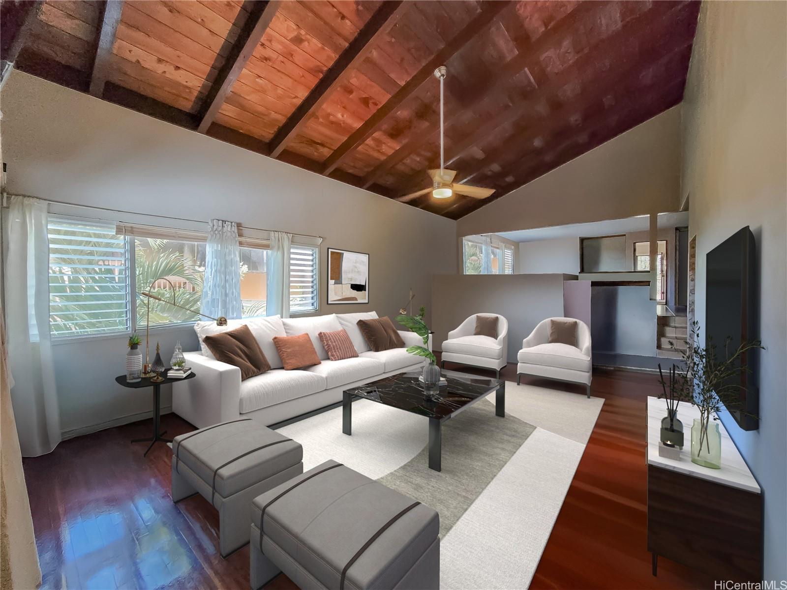 a living room with furniture and a flat screen tv