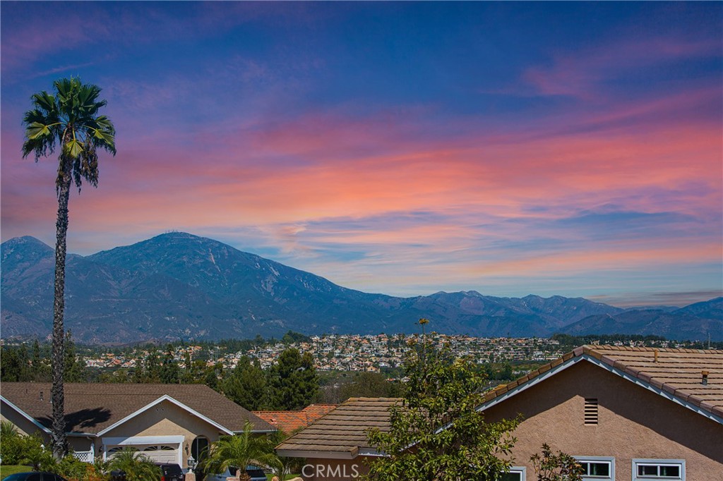 a view of house with mountain view