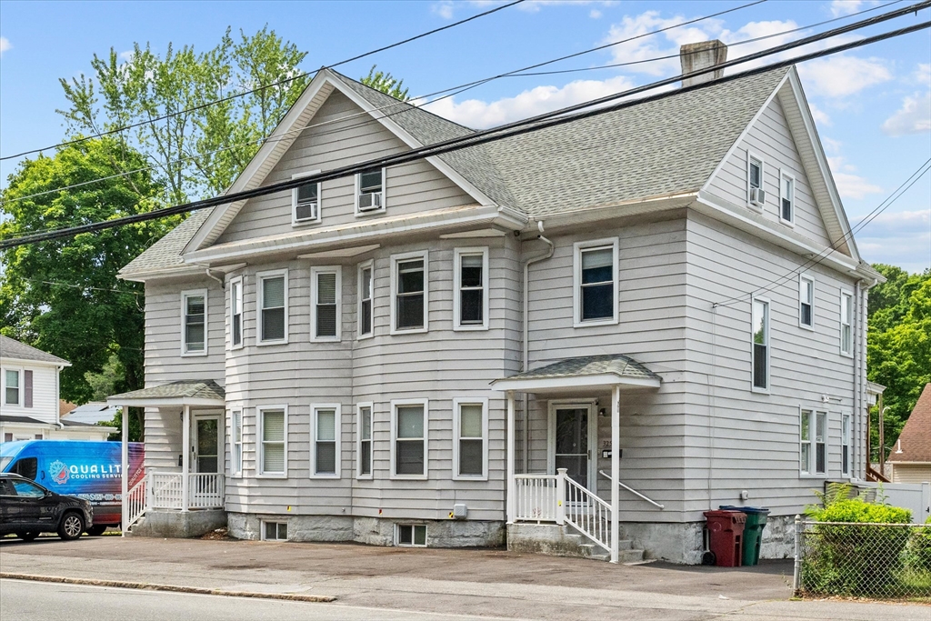 a front view of a house with a garage