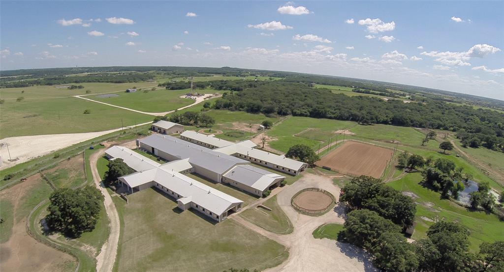 an aerial view of a house with outdoor space