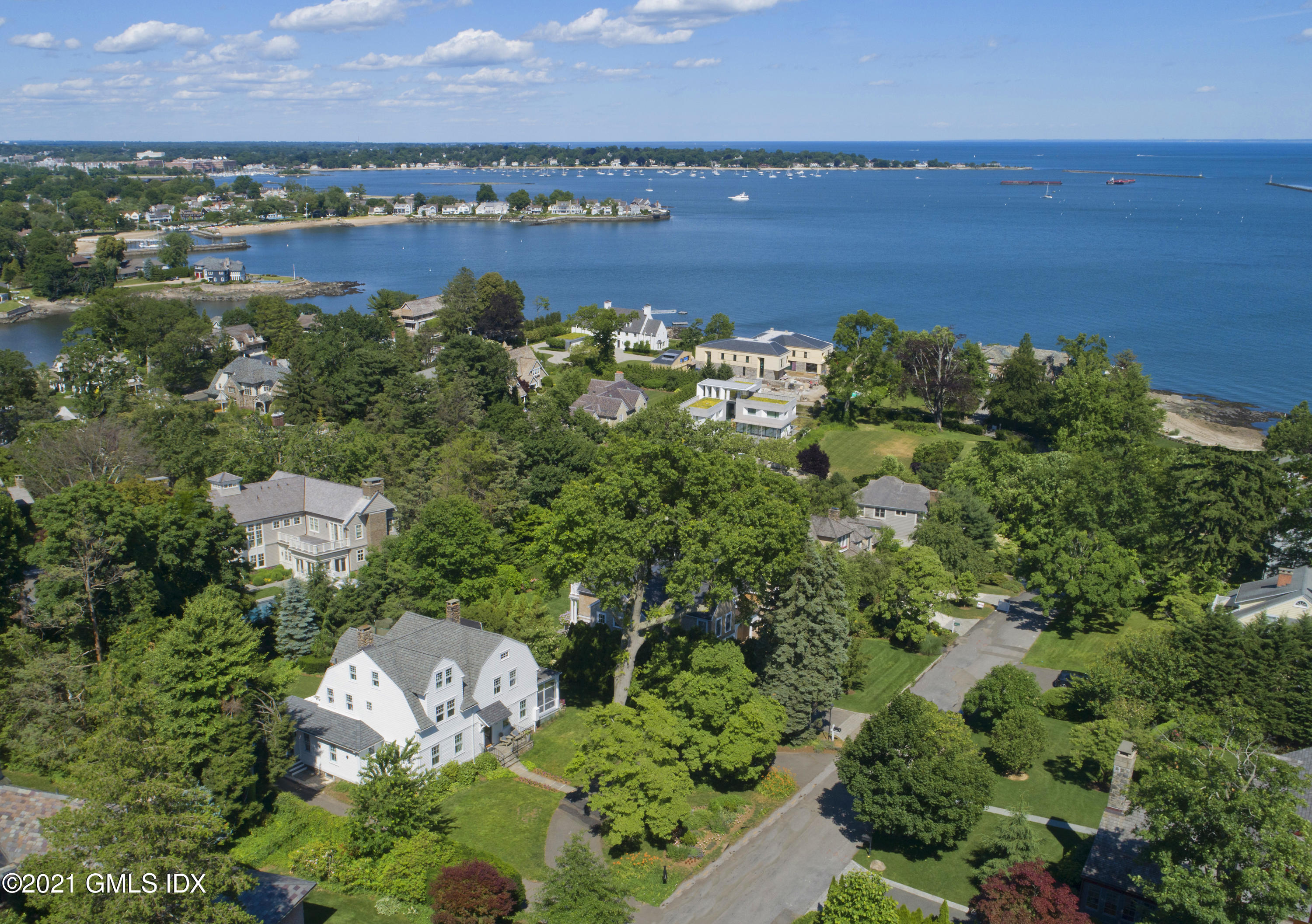 an aerial view of a city with ocean view