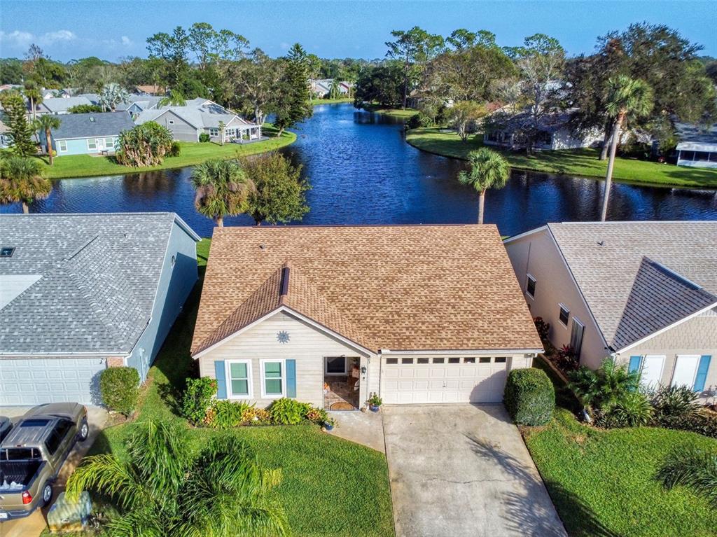 an aerial view of a house with a garden