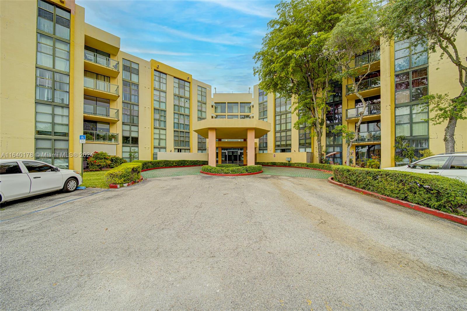 a view of building with parking area