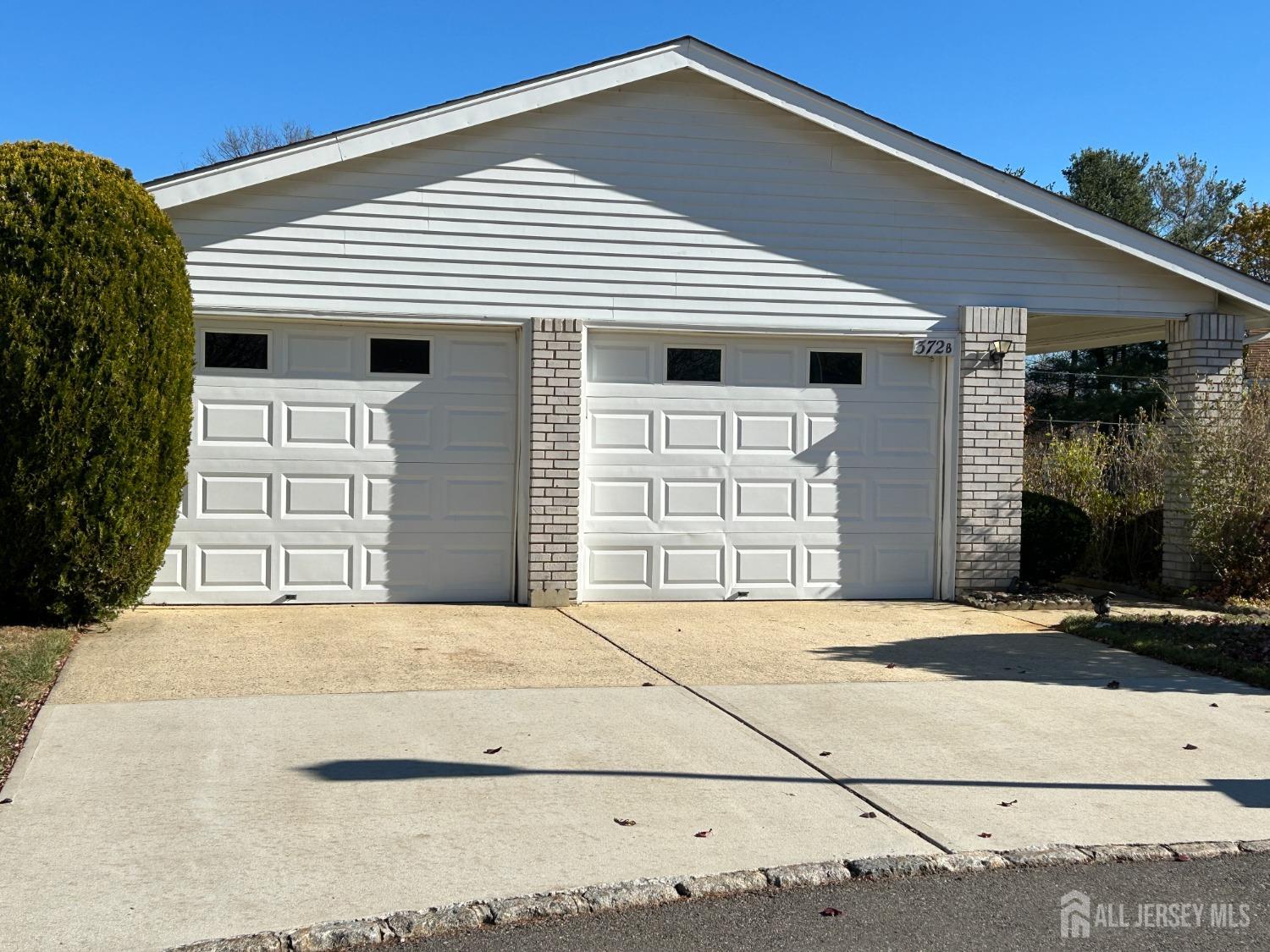 a front view of a house with a garage