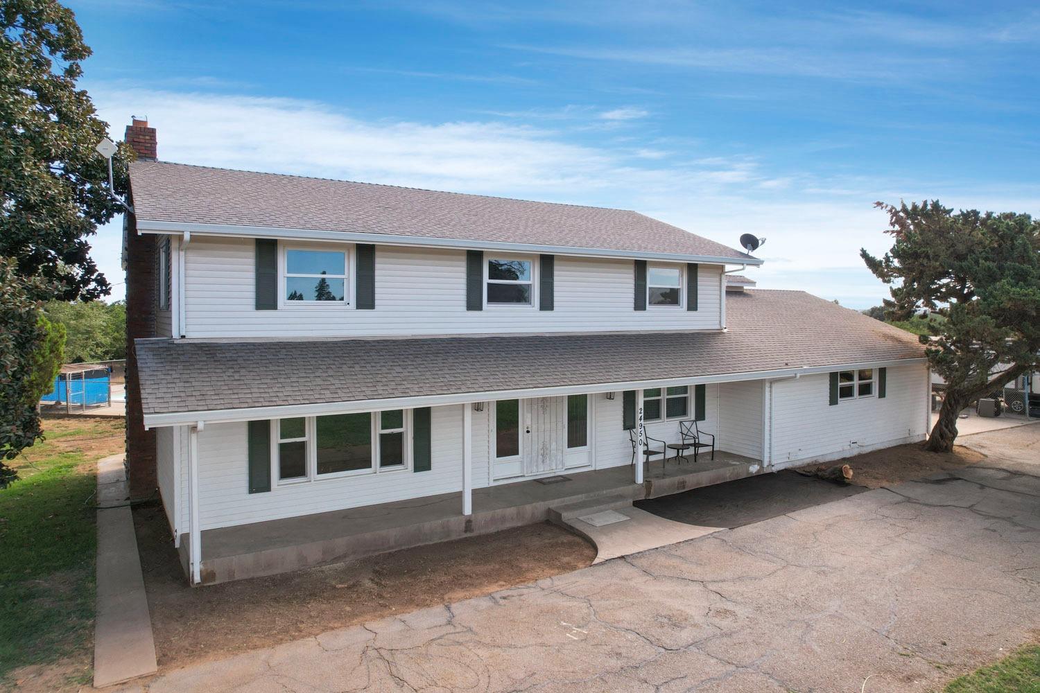 a front view of a house with a garage