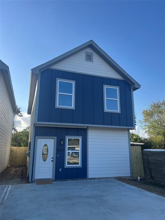 a front view of house with garage