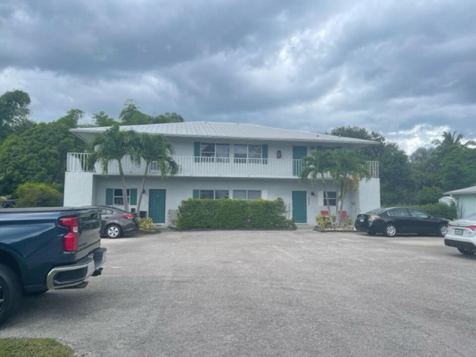 a view of a car park in front of house