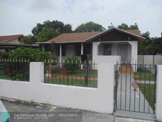 a house with trees in the background