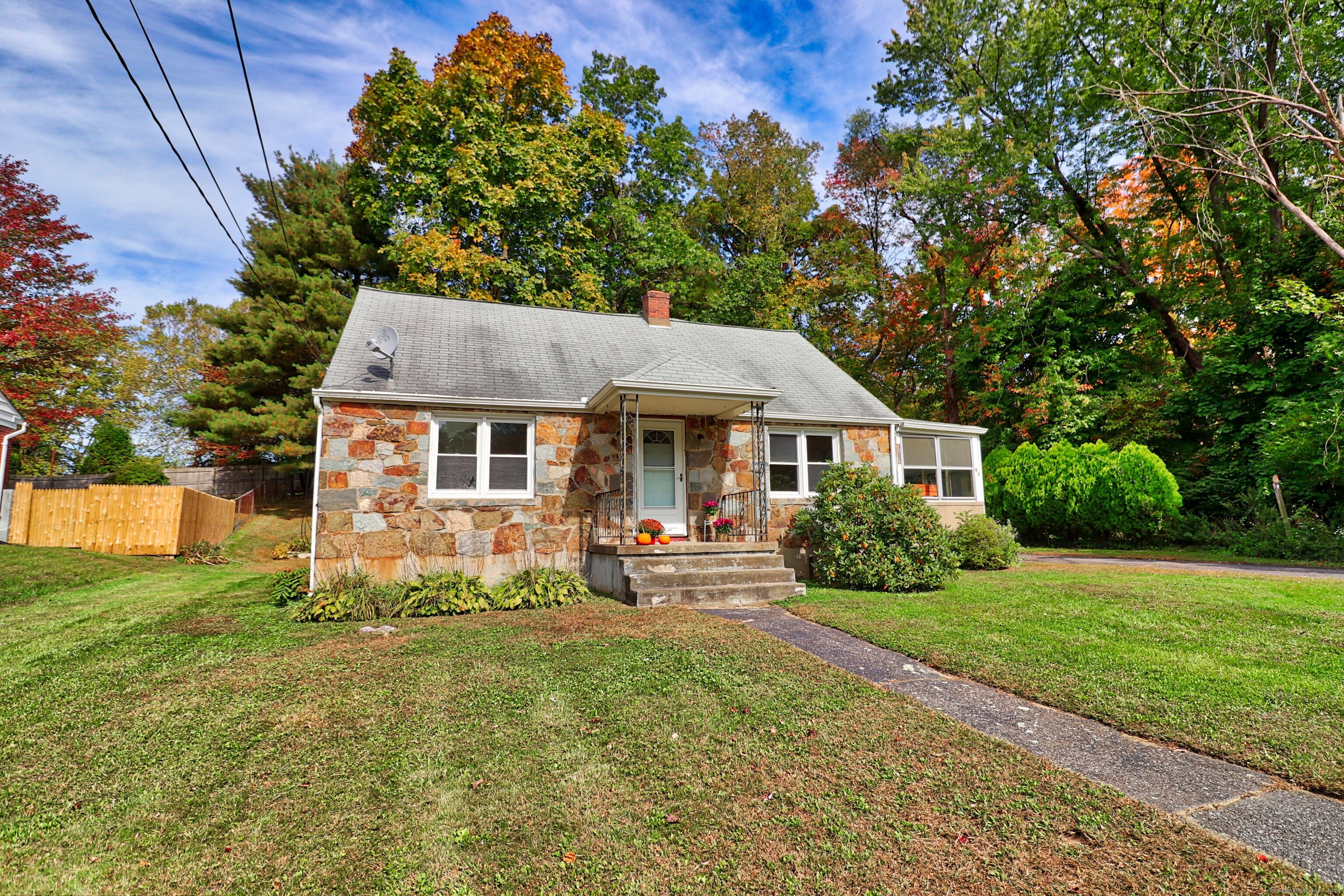 a front view of a house with yard