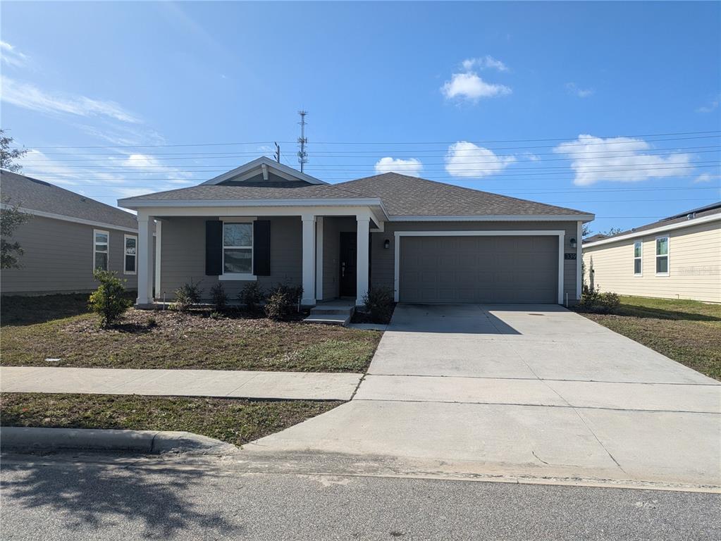 a front view of a house with garage