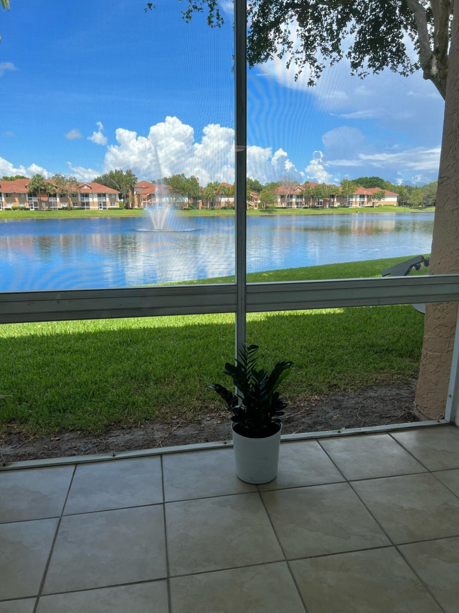 a view of a lake with a garden and lake view