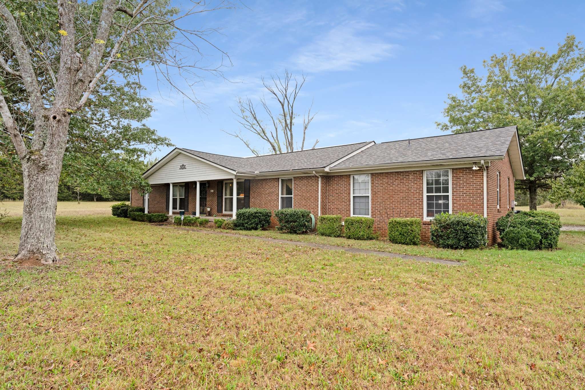 a front view of a house with a yard