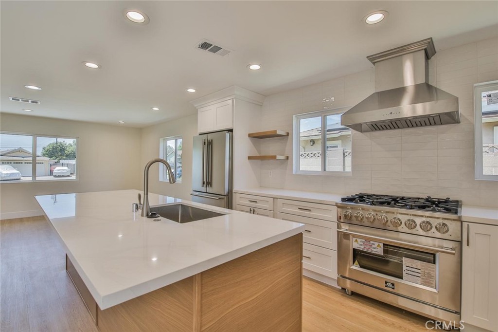 a kitchen with a stove and a sink