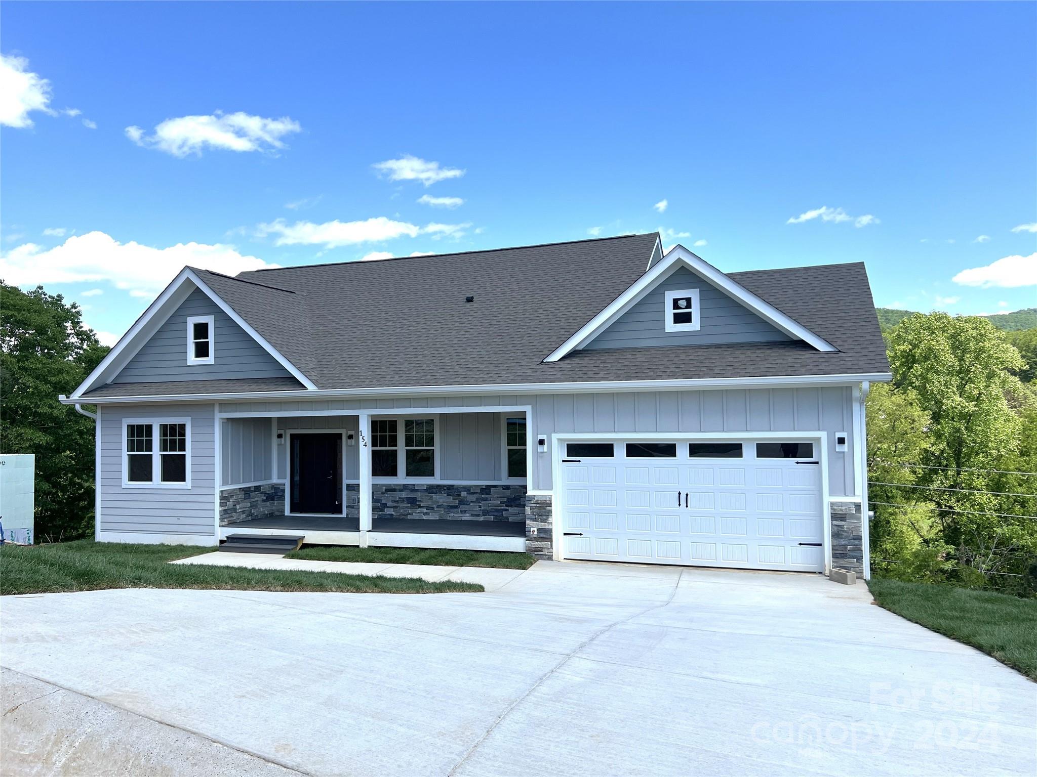 a front view of a house with garage