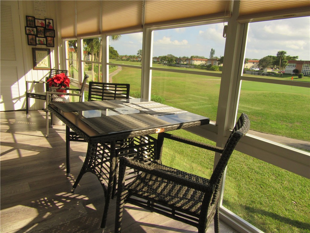 a view of an outdoor dining space with furniture