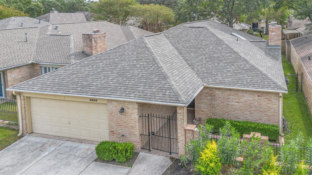 an aerial view of a house with garden