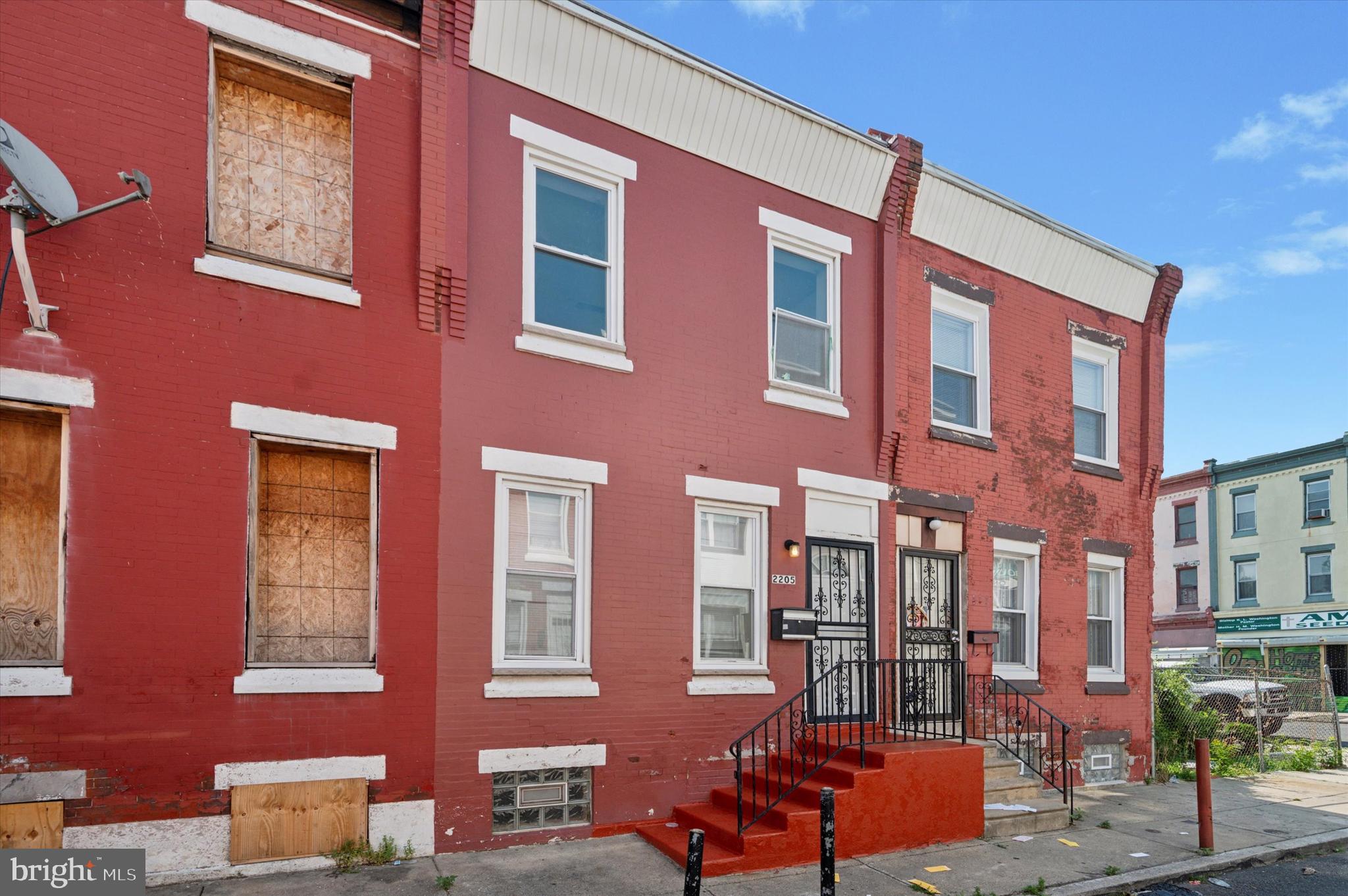 a red brick building that has lot of windows on it