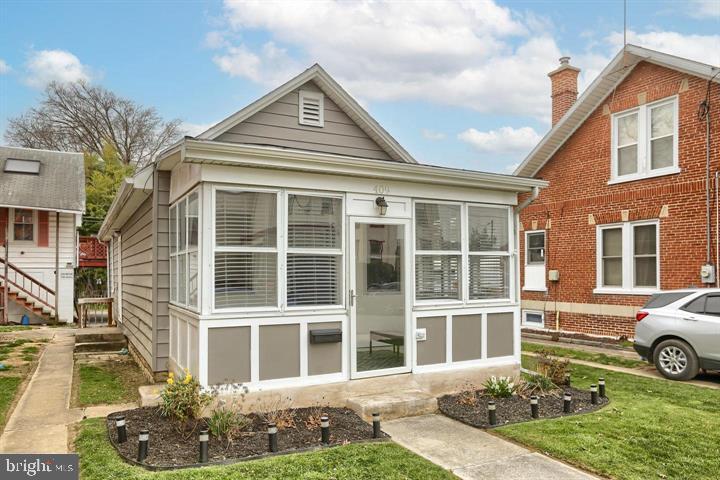 a front view of a house with garden