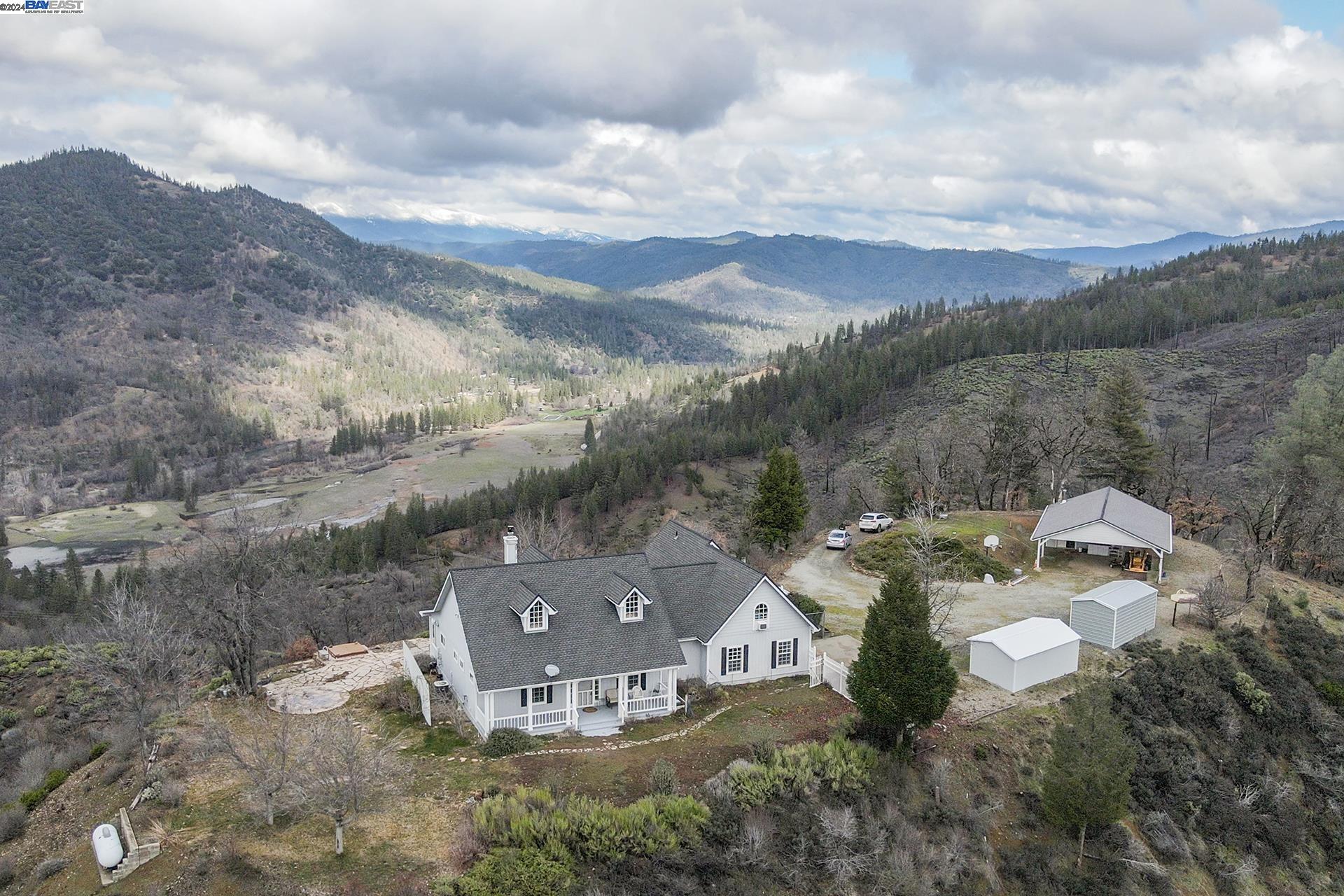 a view of a house with a mountain ground