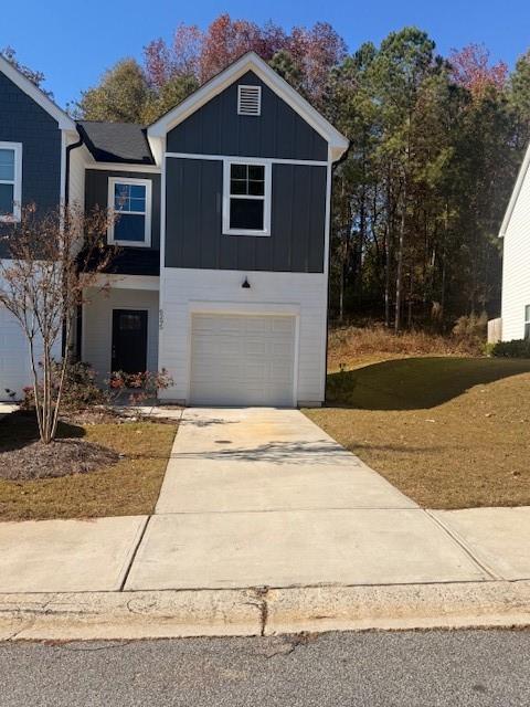 a front view of a house with garage