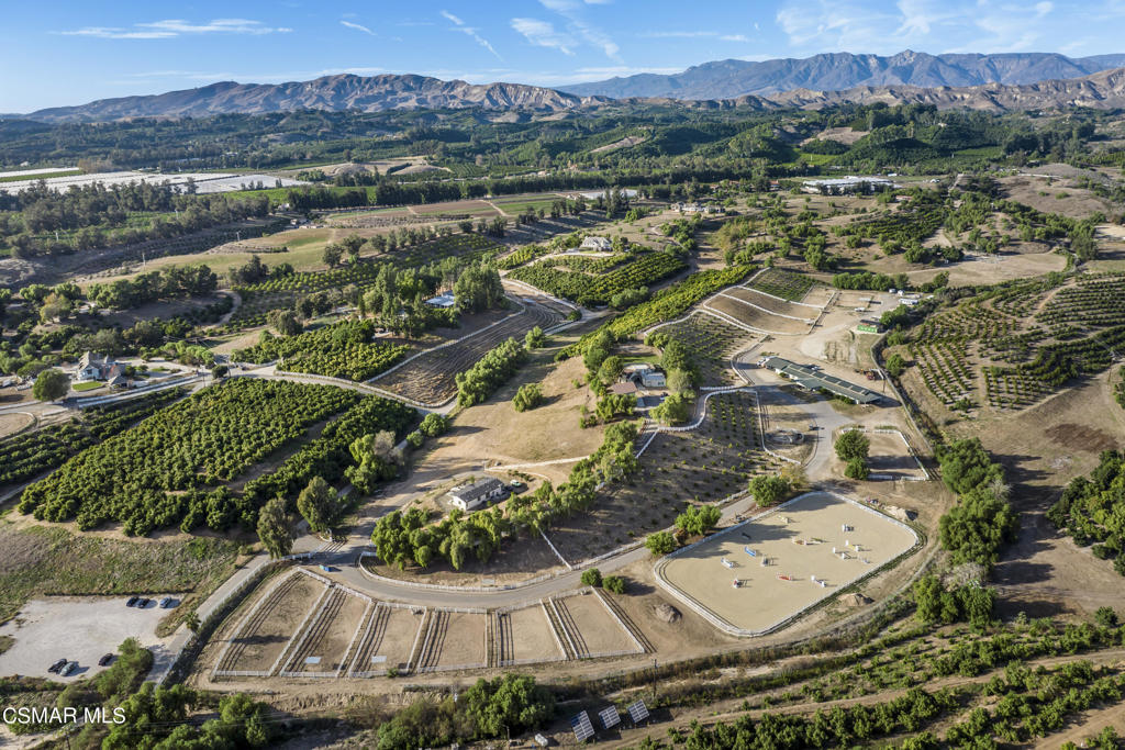 an aerial view of residential house with outdoor space and river