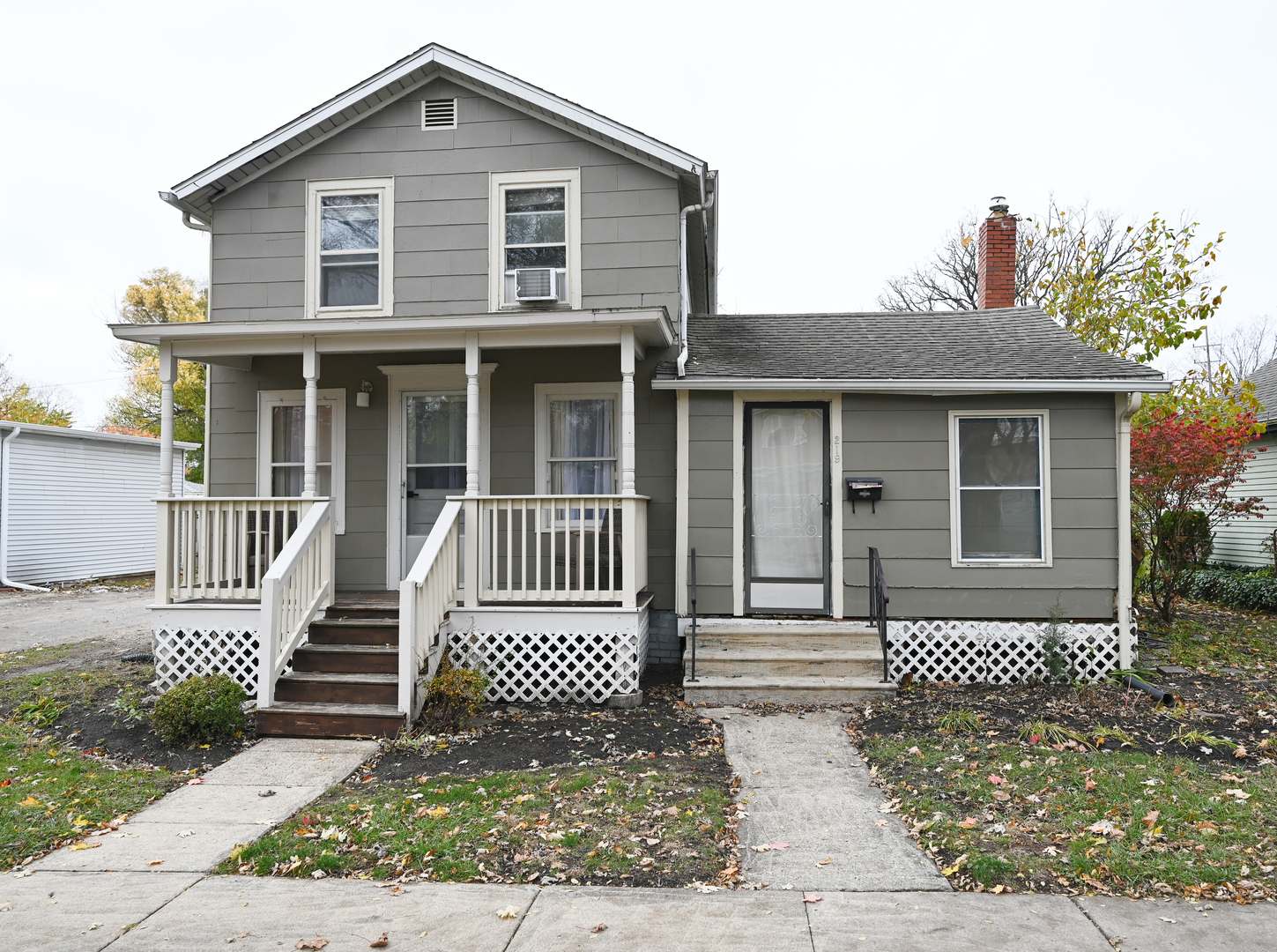 a front view of a house with a fence