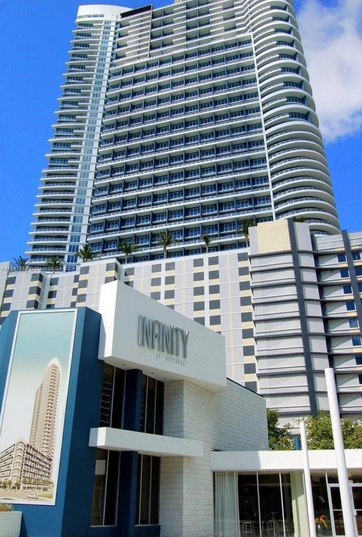 a front view of a building with glass windows