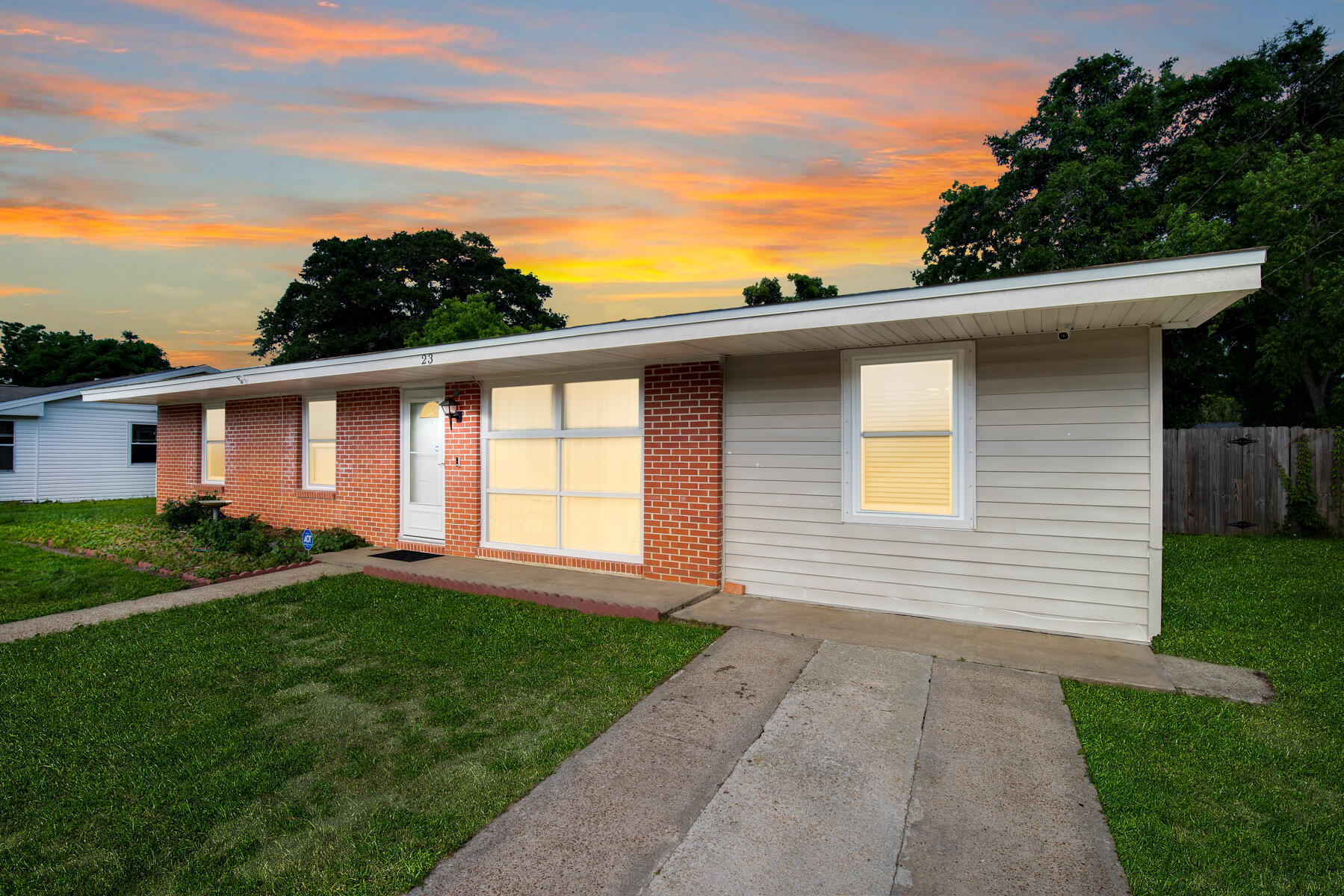 front view of a house with a yard