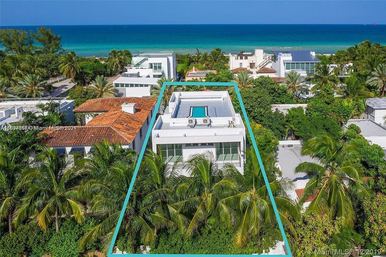 an aerial view of a house with a garden