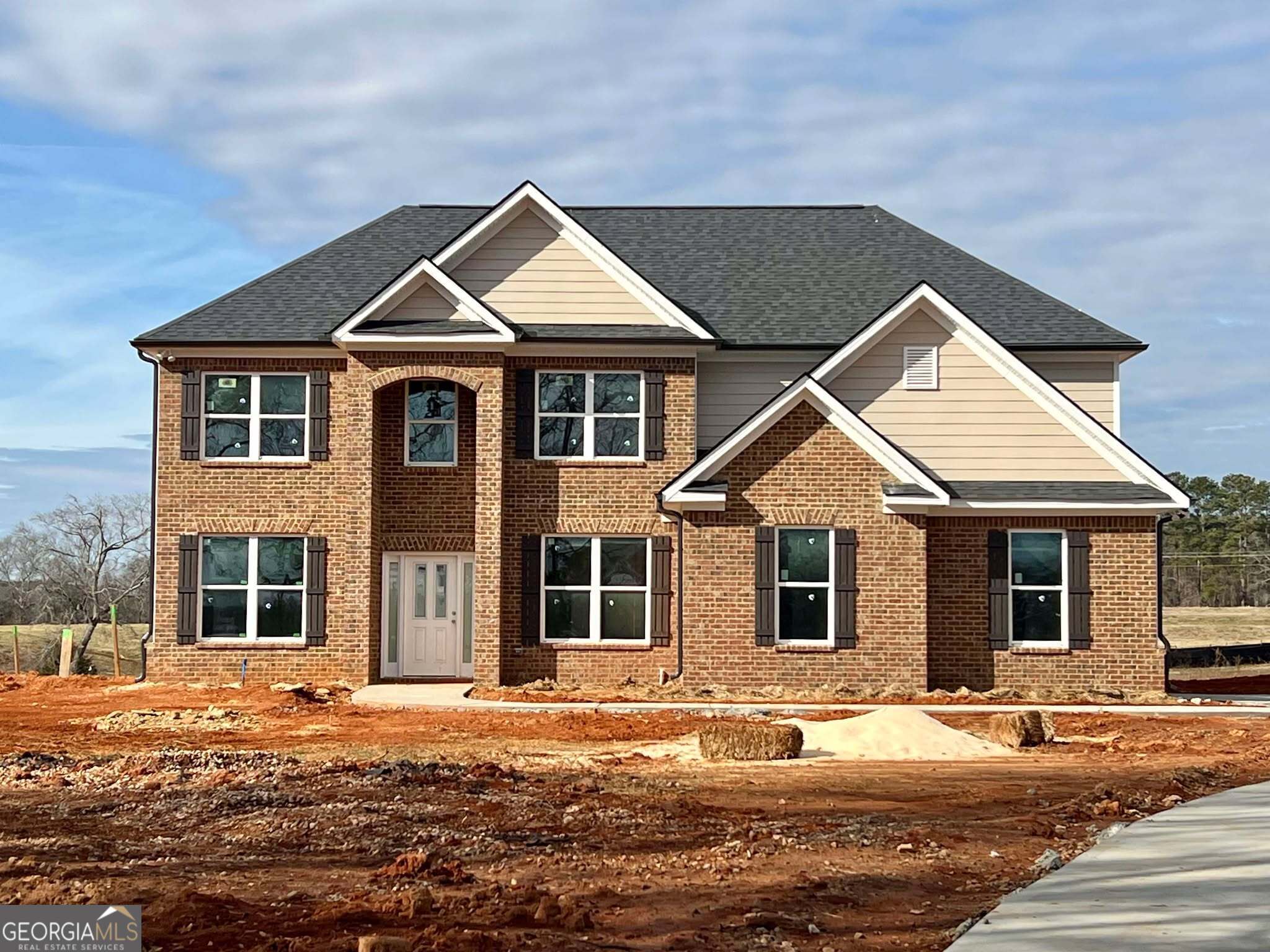 a front view of a house with a yard