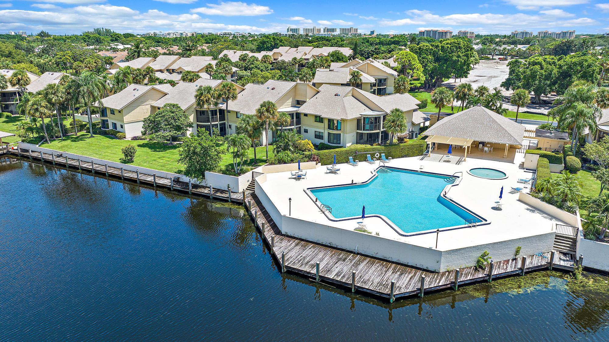 an aerial view of a house with swimming pool patio and outdoor seating