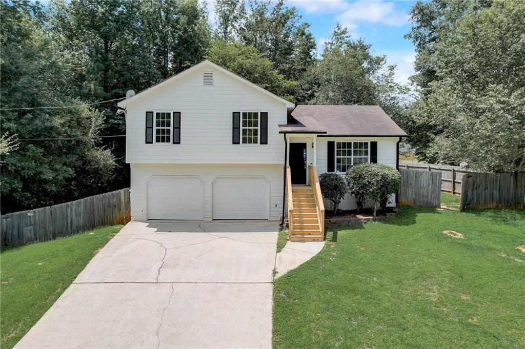 a front view of a house with yard