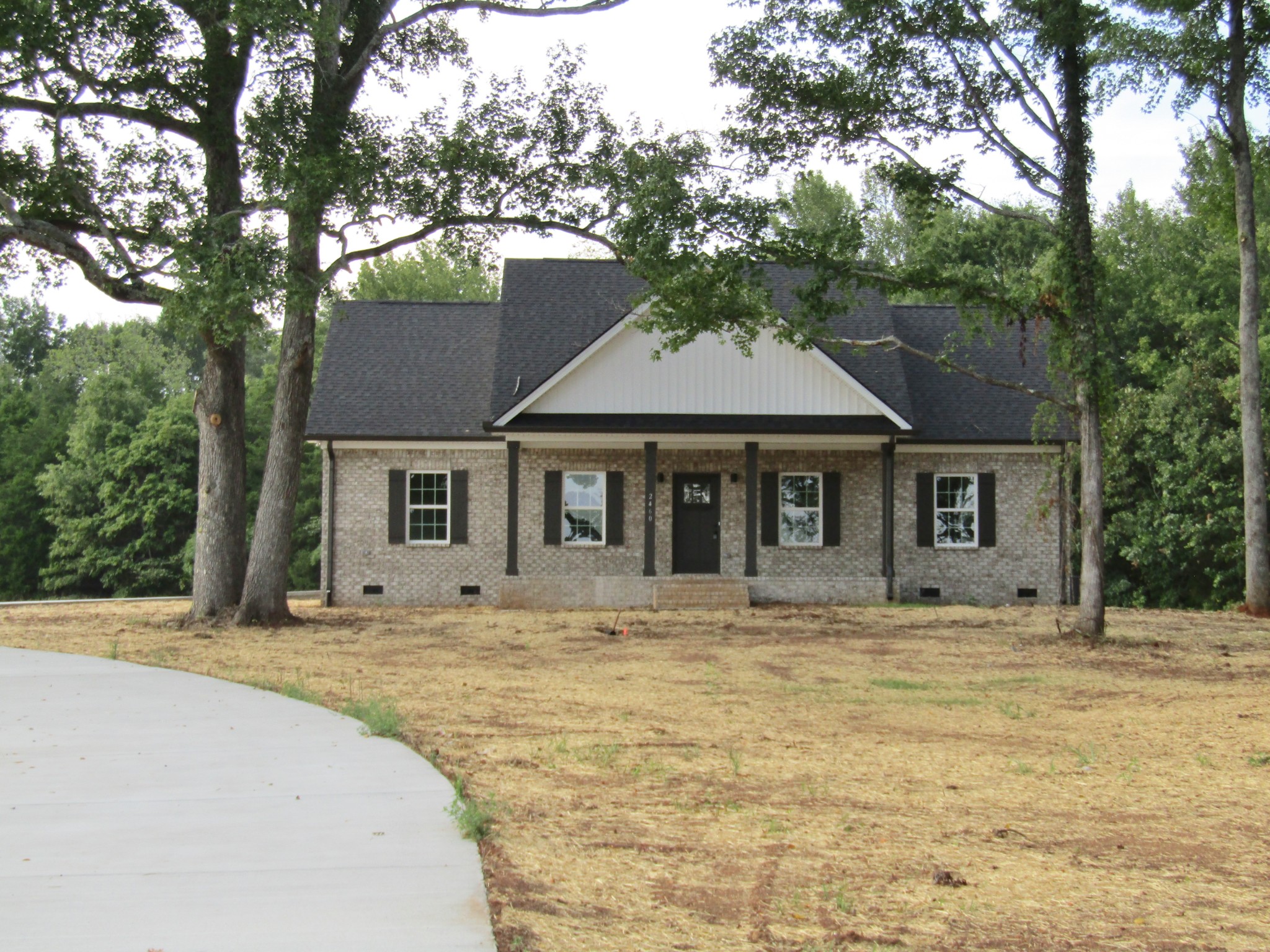 a house with trees in the background