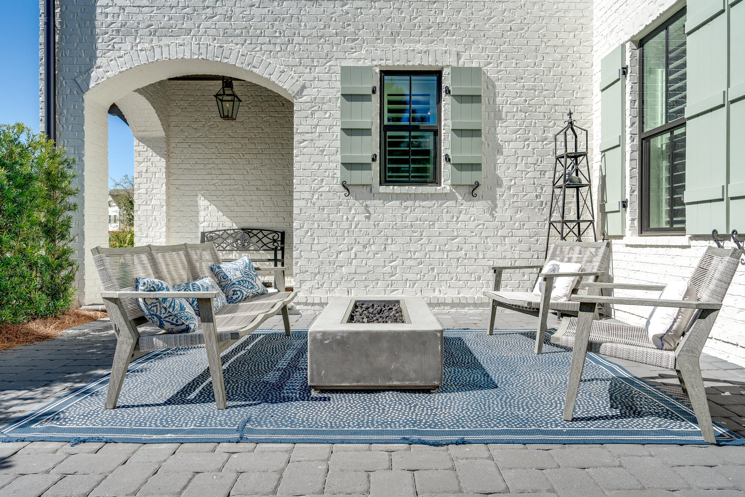 a view of a patio with table and chairs and potted plants